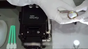 Manutenzione del vetro di copertura del collimatore inferiore